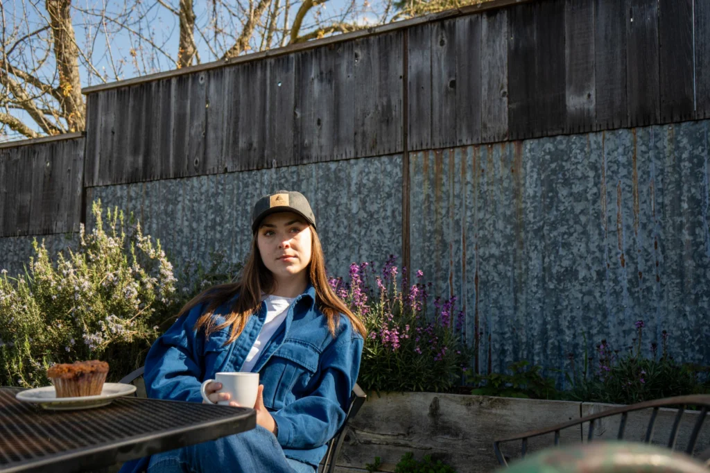 Woman Sitting At Cafe Custom Richardson Hat With Applique