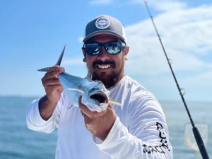 Man Fishing and Wearing Custom Richardson Hat For Brands