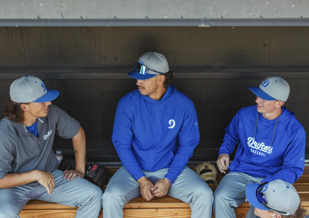 Drifters Baseball Players In Dugout Wearing Richardson Hat & Uniforms