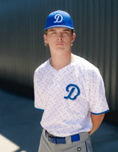 Baseball player wearing custom uniform and hat from Richardson