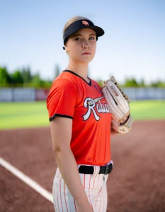 Softball player wearing custom visor with embroidered team logo